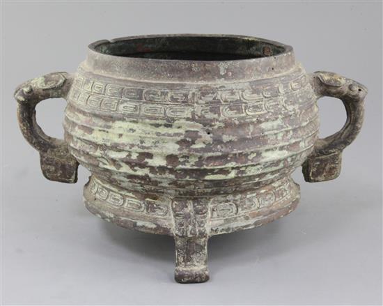 A large Chinese archaic bronze tripod ritual food vessel, Gui, late Western Zhou dynasty, 9th - 8th century B.C., 33.5cm x 18.5cm